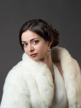 Bride in a white fur coat. Beautiful woman Stock Photos