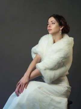 Bride in a white fur coat. Beautiful woman Stock Photos