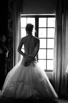 Bride at the window Stock Photos