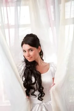 A bride by the window Stock Photos