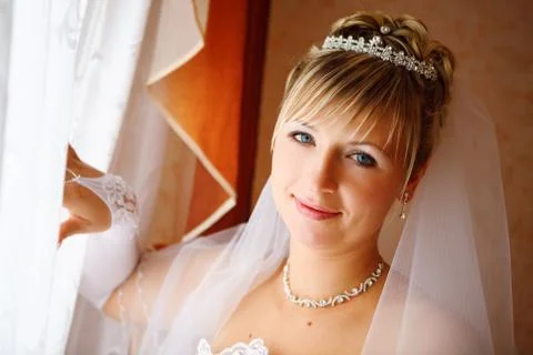 A bride by the window Stock Photos