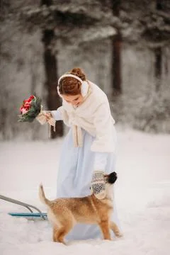 Bride in winter playing with the dog Stock Photos