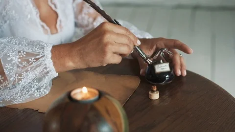 Bride Writes A Vow With A Pen Of Ink On Old Paper. Stock Footage 108680409