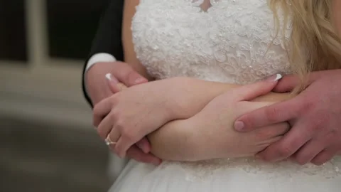 The bridegroom embraces the bride from behind Stock Footage 89422146