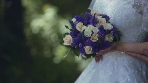 The bridegroom embraces the bride on a wedding walk Stock Footage