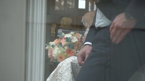 The bridegroom next to the bride puts his hand in his pocket Stock Footage 106998436