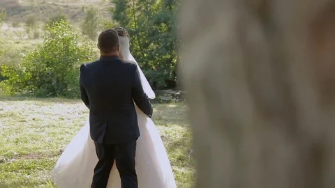 The brides are swirling on the grass 動画素材 77002803