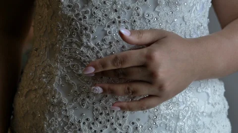 Brides hand in front of her beautiful wedding dress 스톡 동영상 114186086