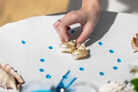 Bride's hand taking wedding ring Stock Photos