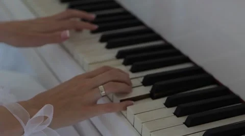 Bride's hands playing the piano Video stock 54474704