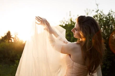 Bride's hands with a ring under a veil Stock Photos