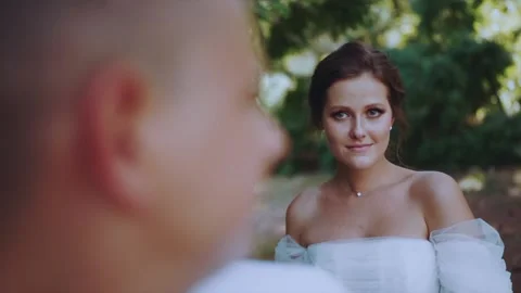 The bride's look in slow motion, shooting from behind the groom's head Stock Footage 168202735
