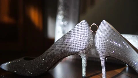 The bride's ring stands between the shoes Video stock 156169261