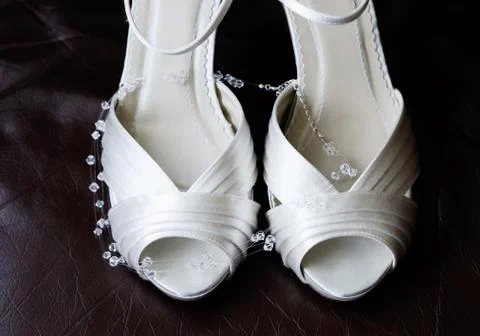 Brides shoes closeup Stock Photos