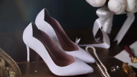 The bride's shoes on the table Stock Footage 156330438