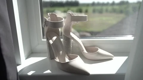 The bride's shoes on the windowsill Stock Footage