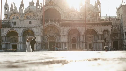 Brides Walk On The Square Of The Holy Mark (Piazza San Marco) And St. Mark's Stock Footage 106143733