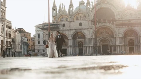 Brides Walk On The Square Of The Holy Mark (Piazza San Marco) And St. Mark's Stock Footage 106143825
