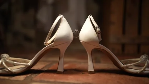 Bride's wedding shoes with engagement ring close-up Stock Footage 277914500