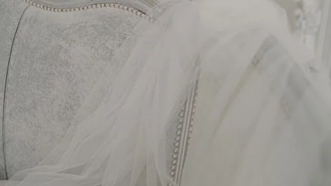 The bride's wedding veil lies on the sofa Stock Footage 143208767