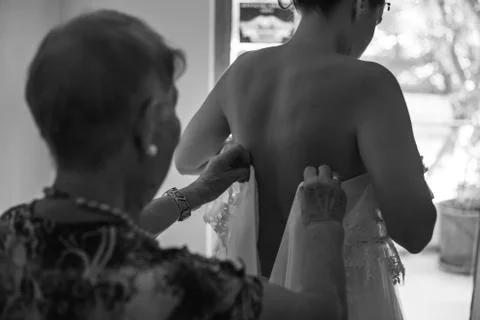 Bridesmaid preparing bride 스톡 사진