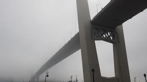 The bridge across the bay is poorly visible through the fog Stock Footage 127161489