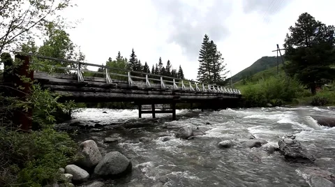 Bridge across mountain river 스톡 동영상 49044469