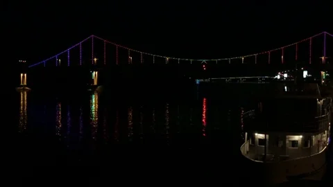 The bridge across the river highlighted by colored lanterns Stock Footage 78071677