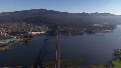 Bridge across the river top view shooting from drone by sunset light aerial v Stock Footage 125267430