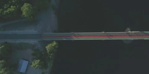 Bridge across river view of above. Riverbank road building Stock Footage 264950322
