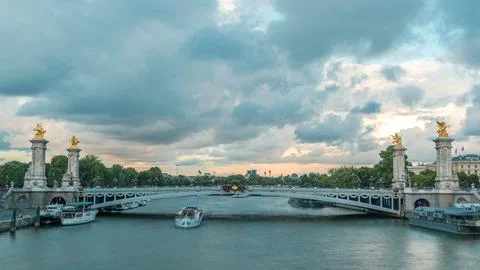 Bridge of Alexandre III spanning the river Seine timelapse. Paris. France. Stock Photos