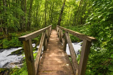 Bridge and fast river Stock Photos