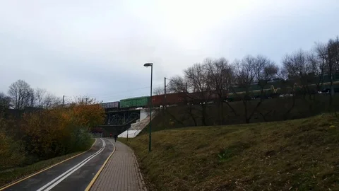 Bridge and heavy train wagons motion Stock Footage 98009282