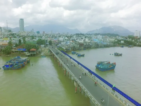 The Bridge And Multi-colored Boats On The Water. Aerial Shoot. Vietnam. Stock Footage 81327109