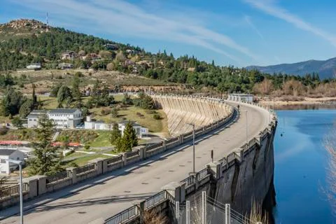 Bridge and navacerrada dam in front of the city. Spain Madrid Guadarrama. Stock Photos