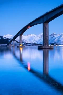 Bridge and reflection on the water surface. Natural landscape in the Lofoten Stock Photos