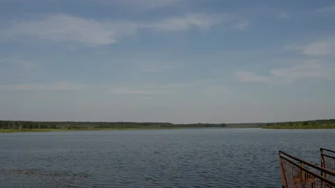Bridge and water flow on the lake Lyadskoe in Belovezhskaya Pushcha, Belarus. Video stock 112368335