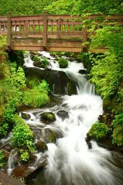 Bridge and waterfall Stock Photos