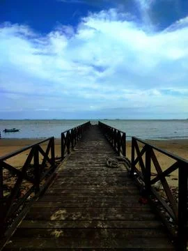 Bridge on the beach Stock Photos