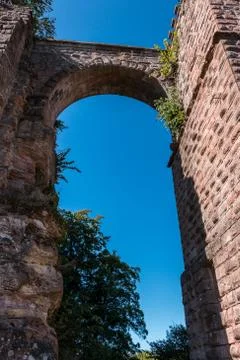A bridge between castle and tower made of red sandstone Stock Photos