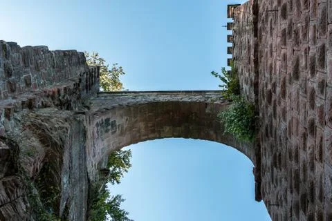 A bridge between castle and tower made of red sandstone Stock Photos
