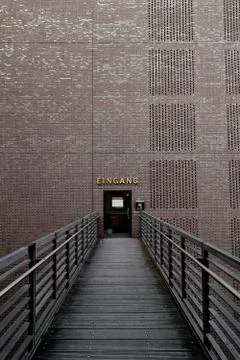 Bridge to a Brick wall with a door to open Stock Photos