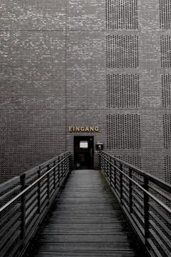 Bridge to a Brick wall with a door to open Stock Photos