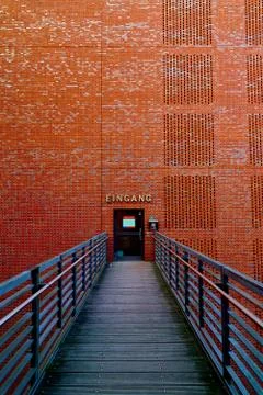 Bridge to a Brick wall with a door to open Stock Photos