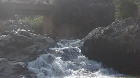 A bridge built over a cascading waterfall in Manica city, Mozambique Video stock 248585140