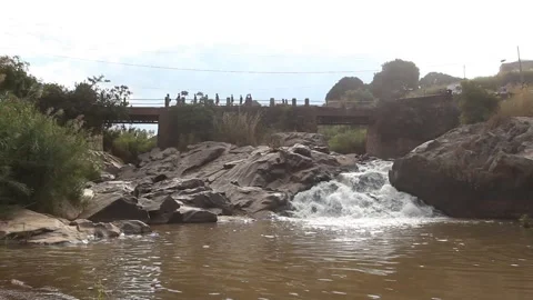 A bridge built over a cascading waterfall in Manica city, Mozambique Video stock 248585178