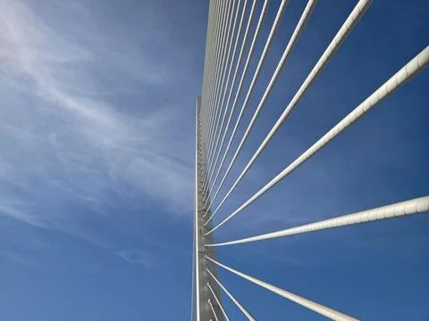 Bridge cables stretch upward dynamically, Cables positioned over bridge asc.. Stock Photos