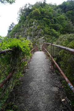 A bridge connecting two mountains 스톡 사진
