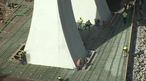 Bridge Const. guys prep rebar at column base Stock Footage 105553241