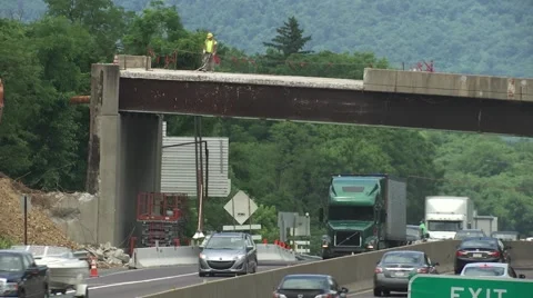 Bridge Construction, removal of bridge over Highway Stock Footage 64953755